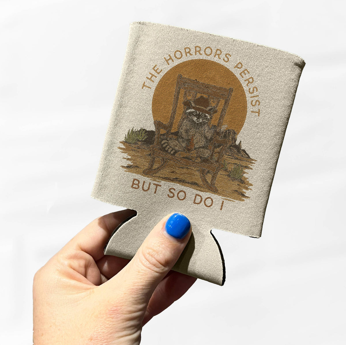 The Horrors Persist But So Do I Raccoon Cowboy Koozie